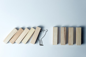 Falling wooden cubes and holding them painted man, as a symbol of support, the right decision and...