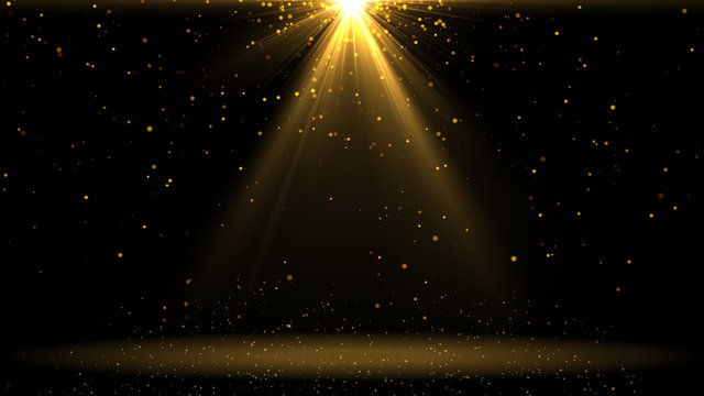 Gold lights shining .golden background with shiny stars and rays.Sparkles or particle glitter lighting . Merry Christmas festive abstract background 
