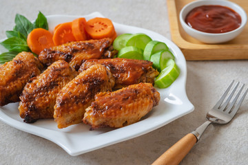 Chicken wings with barbecue sauce on plate