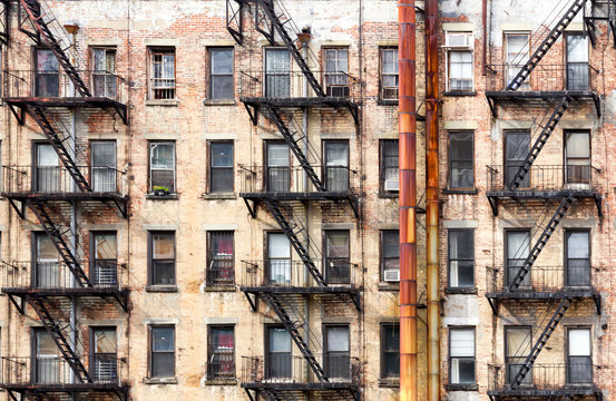 New York City old apartment building with rusted metal pipes