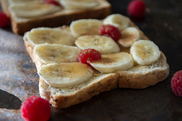Banana and cinnamon toast with raspberry