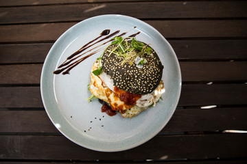 Halloumi burger with black charcoal bun
