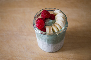 Chia pudding with matcha tea, raspberry and banana