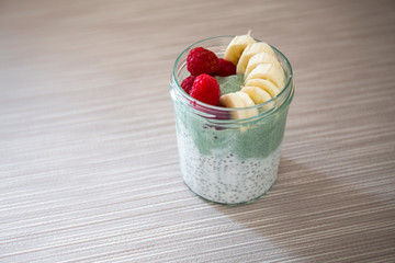 Chia pudding with matcha tea, raspberry and banana