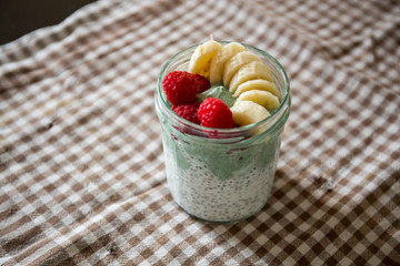 Chia pudding with matcha tea, raspberry and banana