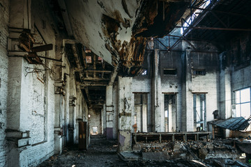 Fototapeta na wymiar Inside burned ruined factory