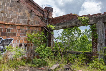 Last remains of an old abandoned factory made of brick in the deep south