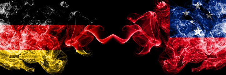 Germany vs Samoa, Samoan smoky mystic flags placed side by side. Thick colored silky smoke flags of Deutschland and Samoa, Samoan