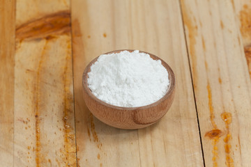 baking soda - sodium bicarbonate, on wooden background