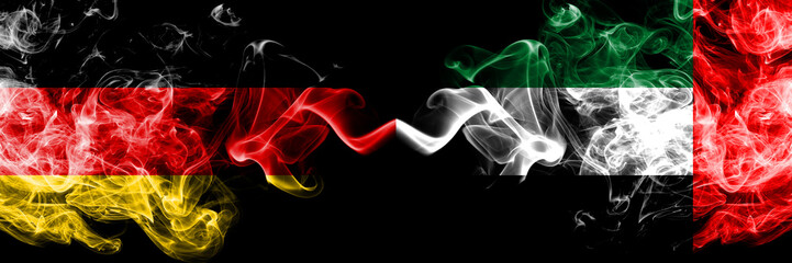 Germany vs United Arab Emirates, Emirati smoky mystic flags placed side by side. Thick colored silky smoke flags of Deutschland and United Arab Emirates, Emirati