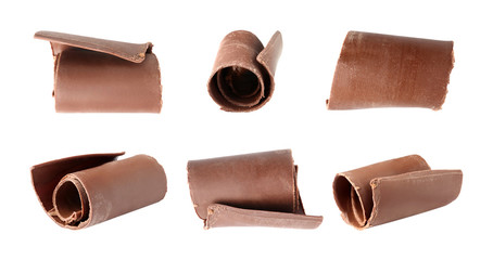 Set of delicious chocolate curls on white background