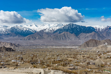 Aerial view of Leh Ladakh City of Kashmir in India with background of Himalaya mountain against blue sky