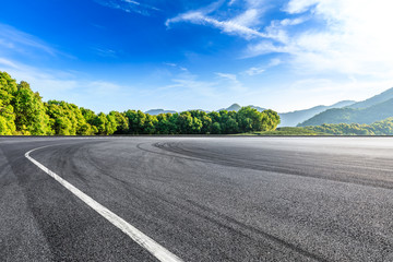 Empty asphalt race track and beautiful natural landscape