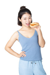 Chinese American woman eating Chicken Sandwich isolated on white background