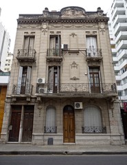 Fototapeta na wymiar Cordoba City, Cordoba, Argentina - 2019: A traditional house near the downtown district displays the typical architectonic style of this city.