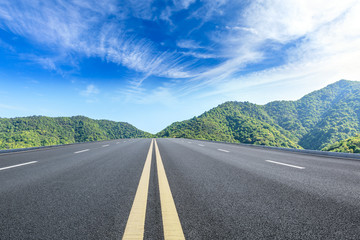 Straight highway and beautiful mountain natural landscape