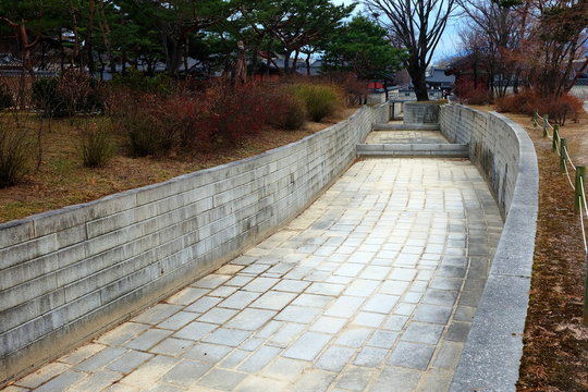 Empty drainage canal in The Secret Garden inside Changdeokgung Ancient Palace Seoul, South Korea in the Winter.