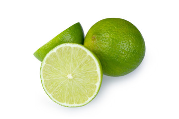 Whole and half with slice of fresh green lime isolated on white background with clipping path