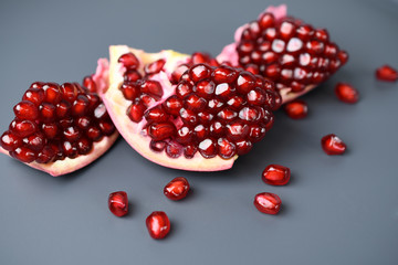 Pomegranate seeds on a dark background