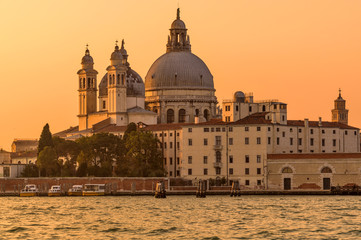 Sunset Punta della Dogana - A close-up sunset view of Basilica of Santa Maria della Salute at Punta della Dogana on the side of Giudecca Canal. Venice, Veneto, Italy.