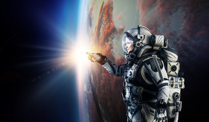 Fototapeta na wymiar Astronaut in space on planet orbit.