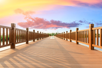 Boardwalk and beautiful clouds in city park