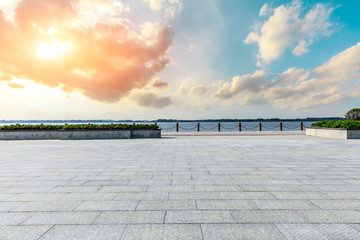 Beautiful lake and walkway with sky clouds at sunset