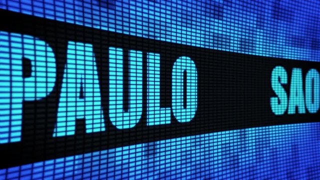 SAO PAULO Side Text Scrolling on Light Blue Digital LED Display Board Pixel Light Screen Looped Animation 4K Background. Sign Board , Blinking Light, Pixel Monitor . LED Wall Pannel