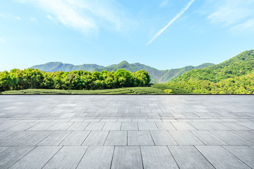 Empty square floor and green mountain natural landscape