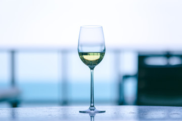 Closeup image of champagne in a wine glass with blurred background