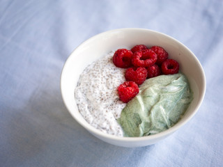 Chia pudding with spirulina yogurt and raspberry