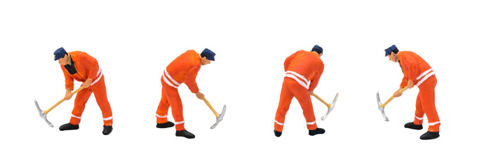 Miniature figurine character as construction worker standing and working in posture isolated on...