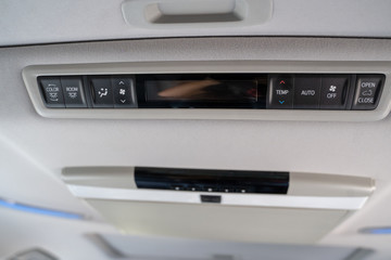 Interior lights in the car with air conditioning grille. air conditioning control panel in luxury car.