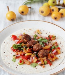 tacos with meatballs and salsa fruit from the medlar. recipes with a medlar. square format 