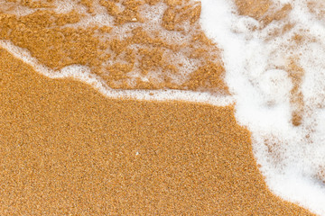 Soft wave of the sea on the sandy beach