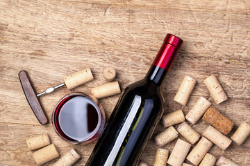 red wine bottle on wooden