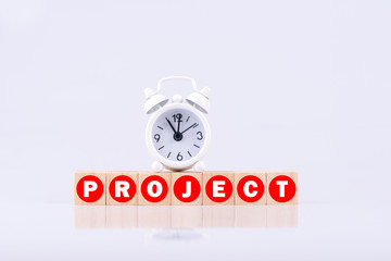 Word PROJECT as lettters on cubes with a clock