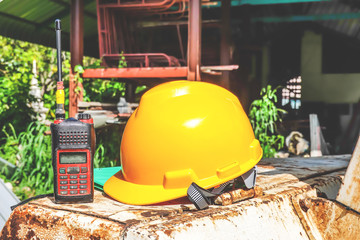 Yellow helmets,document file, radio communication placed on the Excavator