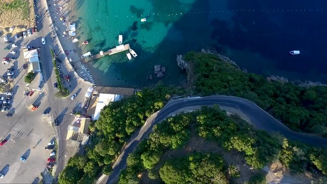 Aerial view of an amazing beach in the island of Corfu in Paleokastritsa area Geece, move forward by drone