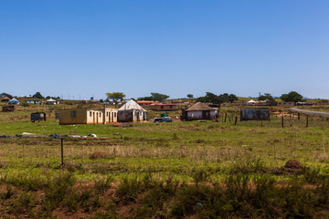 Fototapeta na wymiar The rural huts and dwellings alongside the train tracks and the Ngwangwane river, Creighton, South Africa.