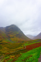 Landscape of the mountains of Glencoe, Lochaber, HIghlands, Scotland, UK in cloudy and foggy day