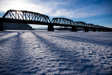 winter trsin bridge, snow, long shadows