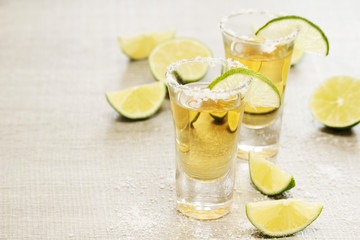 Tequila shots with sliced lime