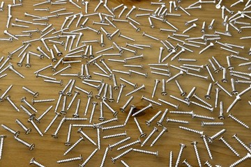 self-tapping screws on wooden table - nice industrial 3D illustration, image for art using