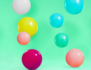 Beautiful colorful ballons with green background