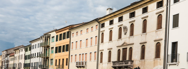 panorama, street with white apartments in Castelfranco Veneto, Italy
