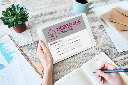 Online mortgage application on screen. Property loan. Business and financial concept.
