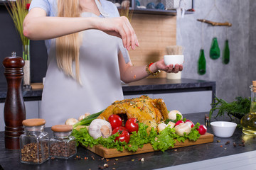 Chef woman hands cooking chicken or turkey in modern comfortable kitchen in restaurant. Cooking, food, restaurant concept