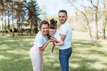 Fototapeta premium Happy family outdoors. Girl, mother.