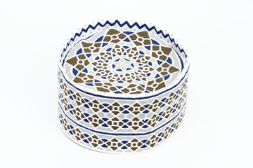 Men traditional muslim cap worn in Oman. Omani cap called kumma on the white background.